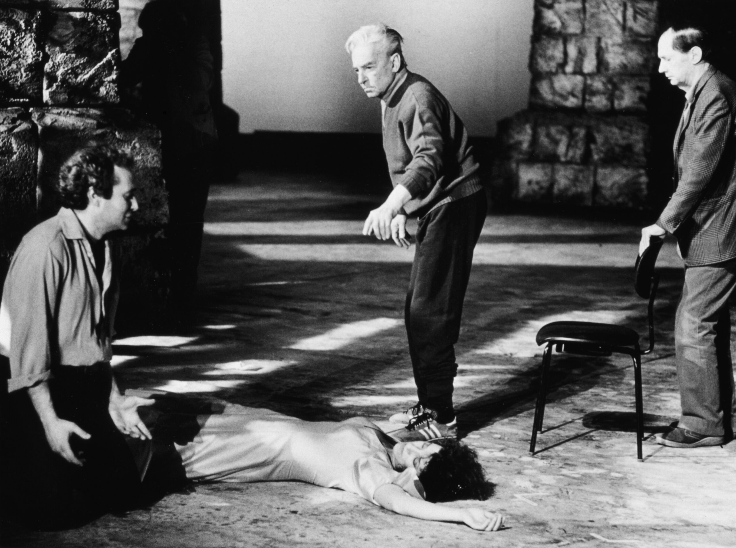 Herbert von Karajan with Agnes Baltsa lying on the floor as Carmen and José Carreras kneeling as Don José during a rehearsal.